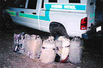 Backpacks of drugs carried by illegal aliens on Barnett Ranch